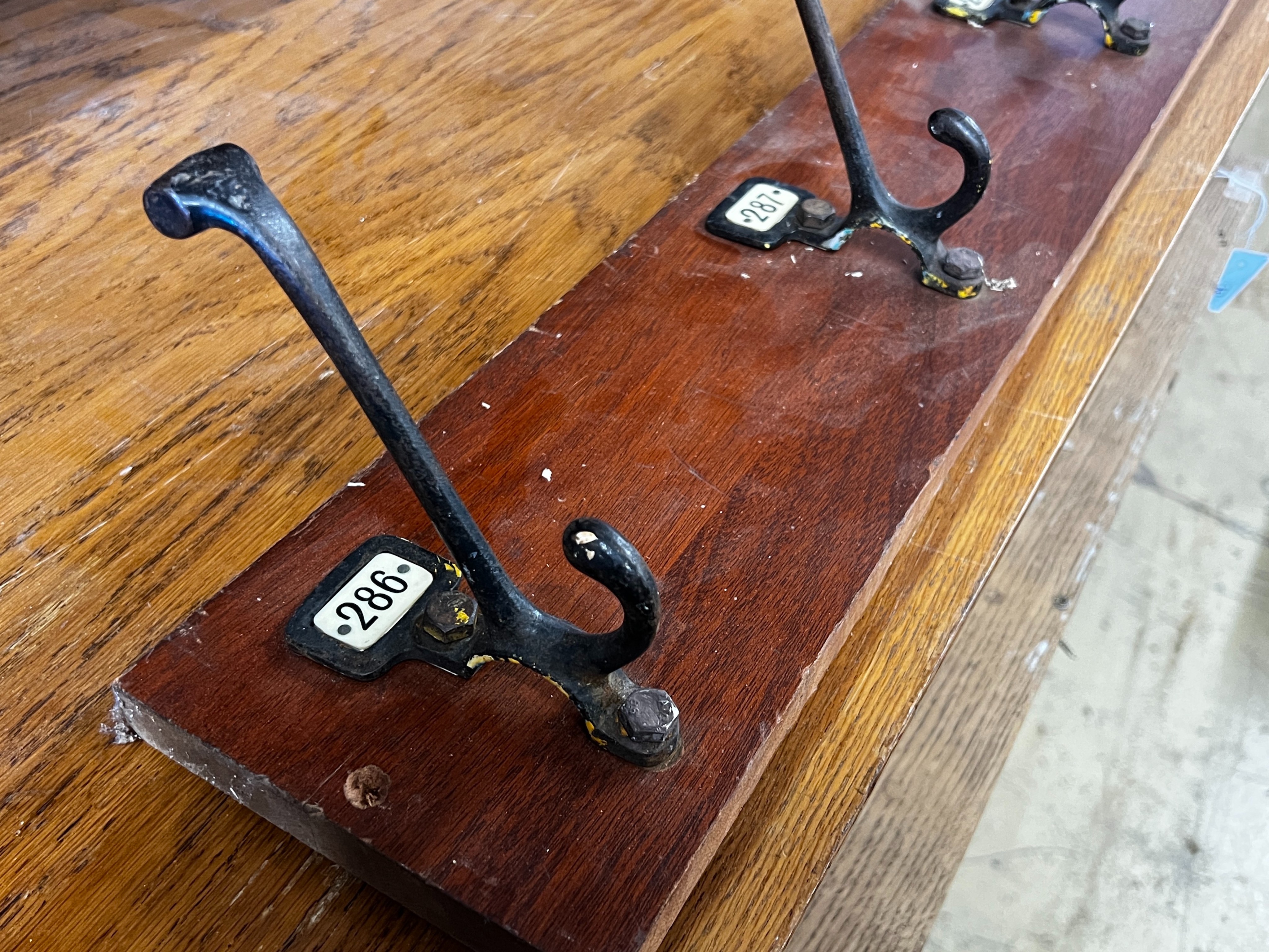 An oak pigeonhole unit, width 112cm, height 86cm together with a vintage four hook coat rack, width 86cm